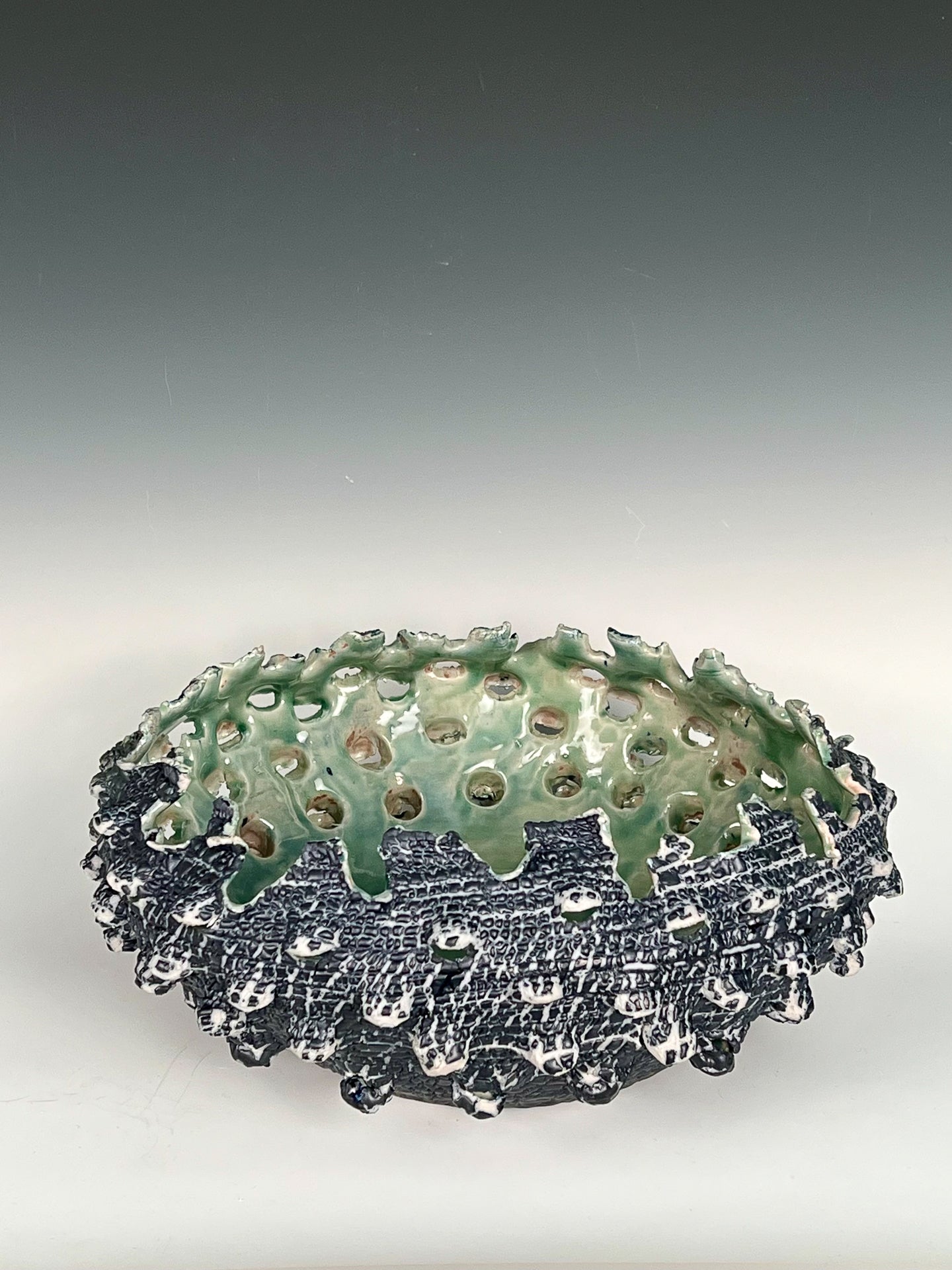 Deep Blue Urchin: Colored slip over, altered & glazed high fired porcelain w/ celadon interior