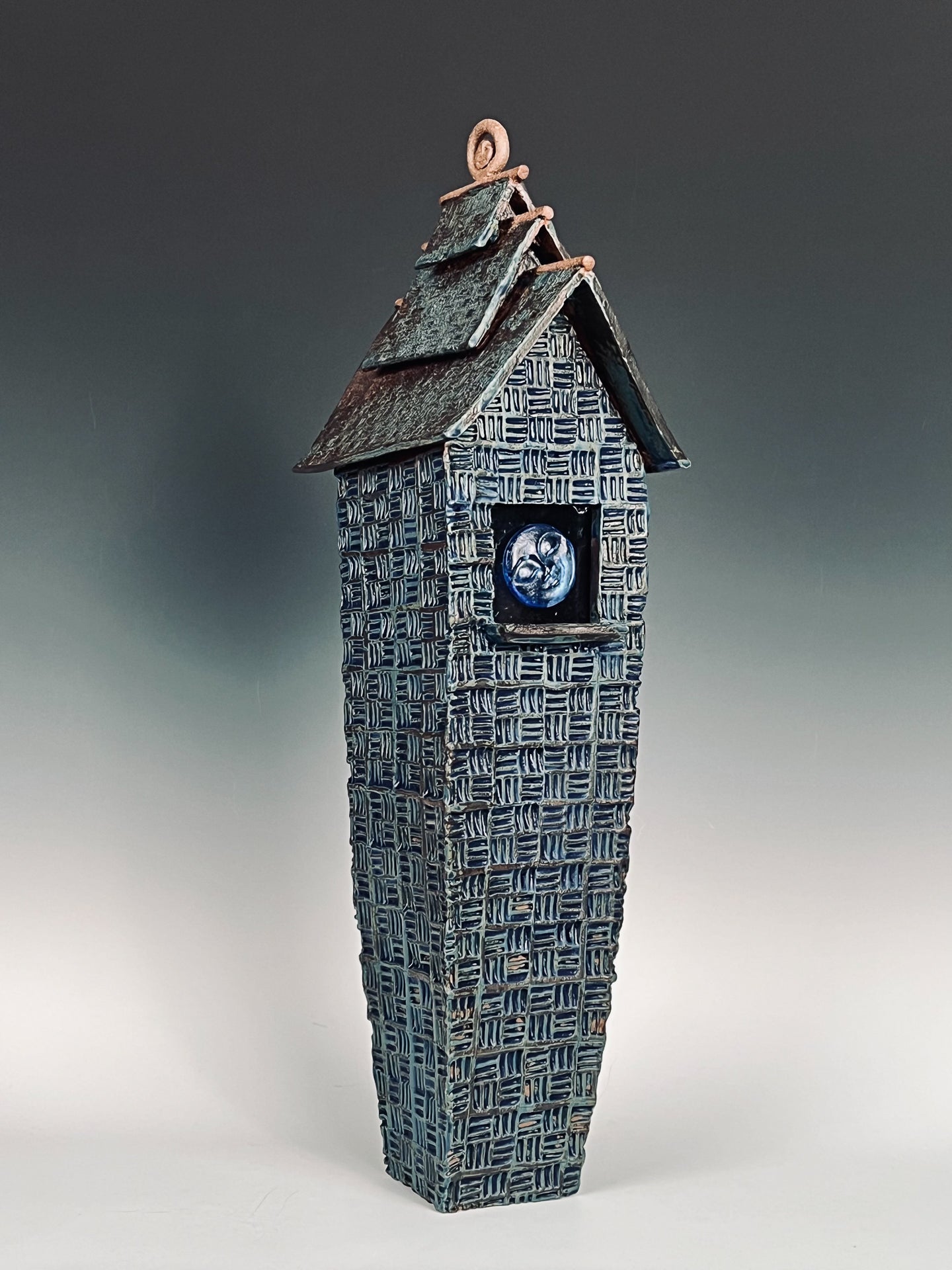 Moon Face Blue Lantern:  Textured & glazed high fired stoneware w/ cast glass window & removable top.