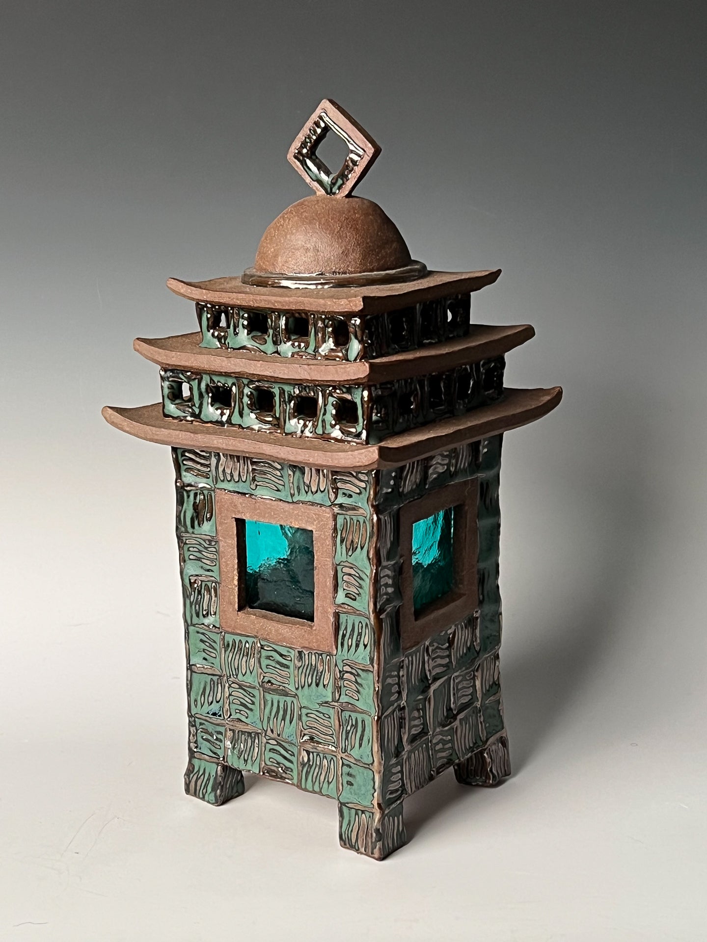 Emerald Window Lantern:  Glazed, textured & stained high fired stoneware w/ glass window & removable top